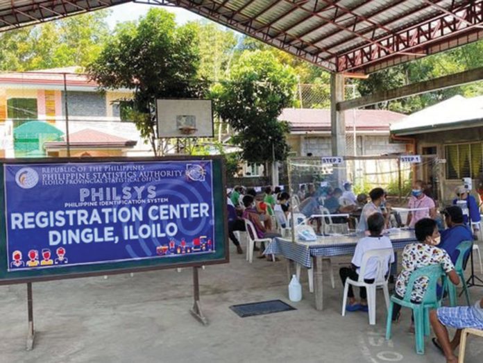 natl-id Residents in Dingle, Iloilo, wait in queue to be registered in the step two registration process of the national ID. As of July 2, NEDA says 37.2 million Filipinos have already signed up for the national ID. PHILIPPINE STATISTICS AUTHORITY
