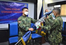3 Negros towns get new police chiefs Police Colonel Romy Palgue (left), director of the Negros Occidental Police Provincial Office, turns over the Philippine National Police flag to Police Captain Ellendie Rebusquillo, new chief of the Binalbagan police station, at Camp Alfredo Montelibano Sr. in Bacolod City on July 1. NOCPPO