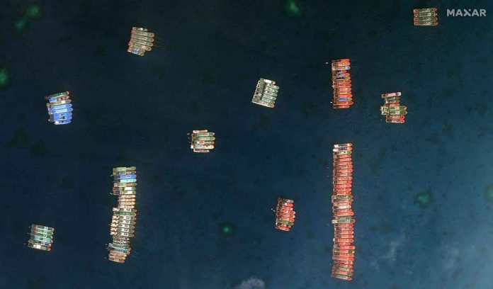 news-carpio Closer view of one set of fishing vessels at Whitsun Reef, which Manila calls the Julian Felipe Reef, in this Maxar handout satellite image. REUTERS