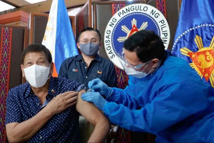 news-duterte President Rodrigo Duterte receives his second dose of the Sinopharm COVID-19 vaccine administered by Health Secretary Francisco Duque III. SENATOR BONG GO