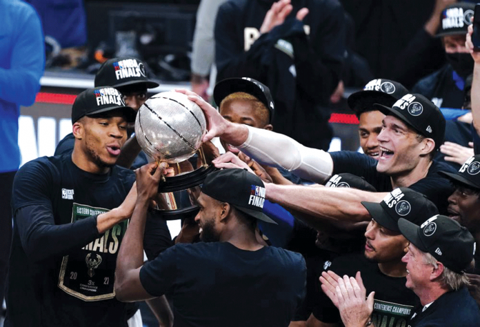 news-nba The Milwaukee Bucks hoist their trophy after beating the Atlanta Hawks in Game 6 of their Eastern Conference finals. AP/JOHN BAZEMORE