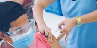 A frontliner belonging to the A1 priority group receives a COVID-19 vaccine. CITY OF SAN FERNANDO INFORMATION OFFICE VIA INQUIRER