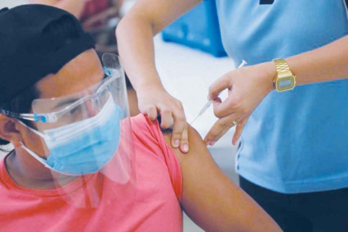 news-vax A frontliner belonging to the A1 priority group receives a COVID-19 vaccine. CITY OF SAN FERNANDO INFORMATION OFFICE VIA INQUIRER
