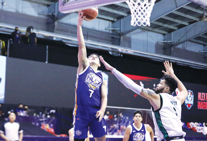 nlex NLEX Road Warriors’ Kevin Alas (2) goes for a layup against the defense of Terrafirma Dyip’s James Laput during their basketball match on Sunday. PBA MEDIA BUREAU