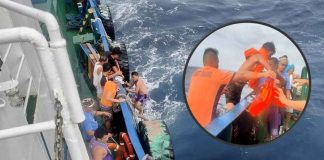 Philippine Coast Guard personnel rescue the crew of a capsized boat in the waters of Semirara Island in Antique. PCG-ANTIQUE PHOTO