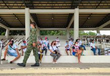 Residents of Barangay Malipayon, Iloilo City wait their turn to avail themselves of the cash aid under the Department of Social Welfare and Development’s Individuals in Crisis Situation program. PANAY NEWS PHOTO