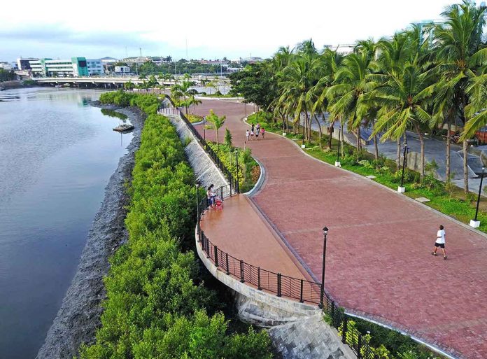 Iloilo City's Iloilo River Esplanade is an example of a thriving coastal and marine ecosystem. The Iloilo River is a renowned tourist destination because of its breathtaking magnificence and beautiful green spaces. LIPAD AERIAL PHOTOGRAPHY/PAULO ALCAZAREN