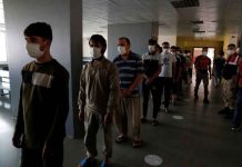 Turkey reinforces border to block any Afghan migrant wave Migrants, mostly from Afghanistan, wait in line for lunch at a repatriation center in the border city of Van, Turkey, on Monday. REUTERS/MURAD SEZER