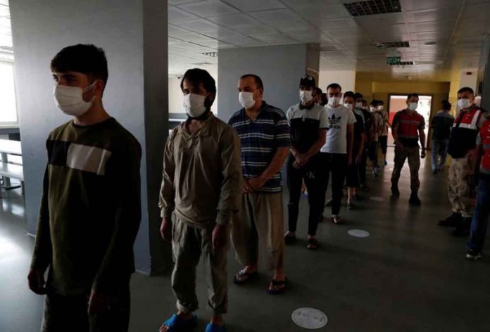 afghan-migrants Migrants, mostly from Afghanistan, wait in line for lunch at a repatriation center in the border city of Van, Turkey, on Monday. REUTERS/MURAD SEZER