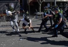 Australian police clash with anti-lockdown protesters Police use pepper spray against protesters in Melbourne, Australia. EPA