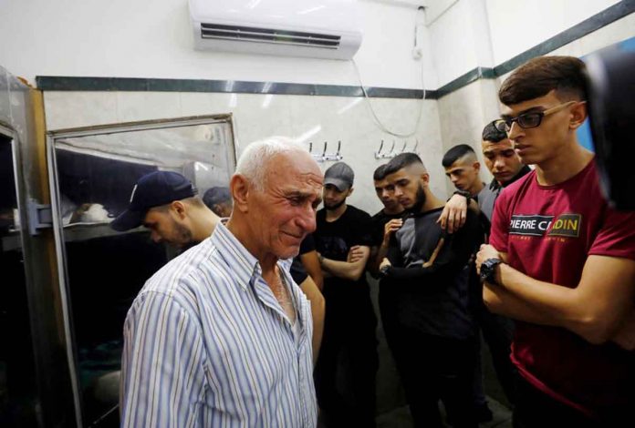 People react at a morgue after Israeli forces killed four Palestinians during clashes on Monday in Jenin, in the Israeli-occupied West Bank. REUTERS/MOHAMAD TOROKMAN