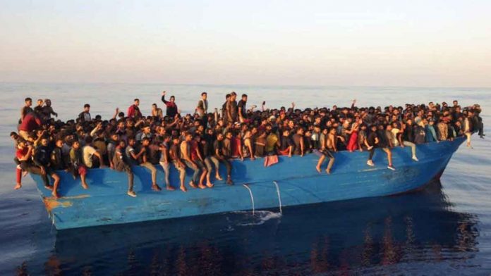 migrants Hundreds of migrants crammed into a decrepit fishing boat were rescued off the island of Lampedusa, Italy, on Saturday. EPA