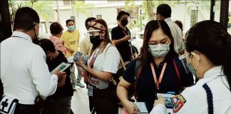 NO VAX, NO ENTRY. Employees and the transacting public present their vaccination cards at the entrance of the Iloilo City Hall. Beginning yesterday, Aug. 2, 2021, the city government has restricted the entry of people to only those who have been fully vaccinated against coronavirus disease 2019. PANAY NEWS PHOTO