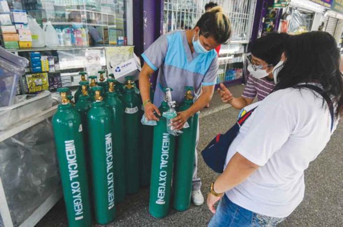 oxygen-tank Buyers check the available medical oxygen tanks in a supply store in Manila. There is no shortage of oxygen supply in the Philippines amid the COVID pandemic, according to the Department of Trade and Industry. Secretary Ramon Lopez says there was even a surplus of supply but warned that DTI would be running after erring distributors and hoarders of oxygen tanks. ABS-CBN NEWS