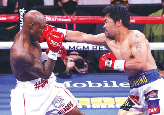pacquiao Manny Pacquiao (right) attacks Yordenis Ugas with a right straight punch to the face during their world welterweight championship bout. Despite failing to reclaim his WBA title, the Filipino boxer stated that a rematch with the Cuban slugger in January next year is possible. AFP