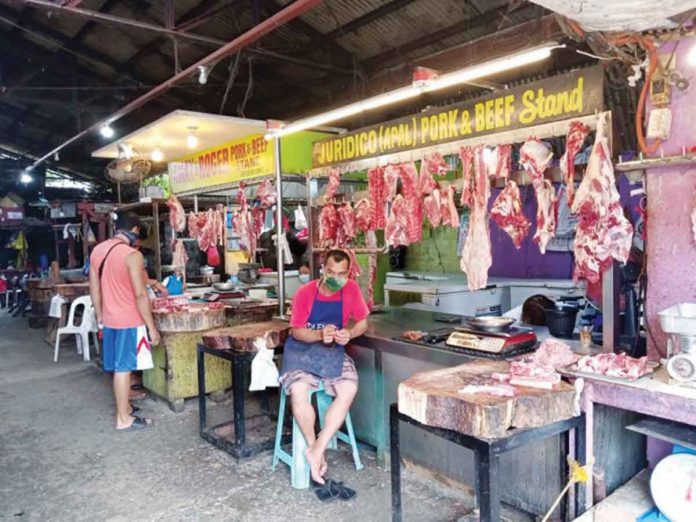 pork A vendor tends his beef and pork stand in a market in Pavia, Iloilo. The national government lost P1.356 billion after reducing the tariff for imported pork, but the Department of Agriculture and the Department of Trade and Industry claimed that consumers have benefitted from the tariff cut on pork imports. PN FILE PHOTO