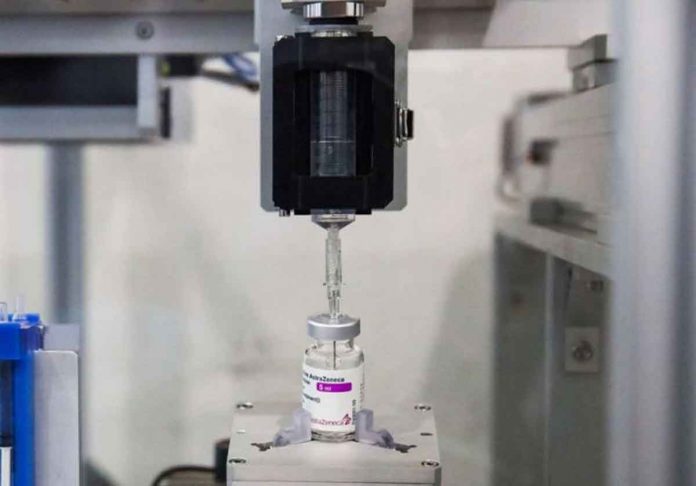 robotic-system-thailand A vaccine extraction machine called AutoVacc, designed by the Chulalongkorn University's Biomedical Engineering Research Center to extract extra doses out of AstraZeneca vaccine vials. REUTERS/JUARAWEE KITTISILPA