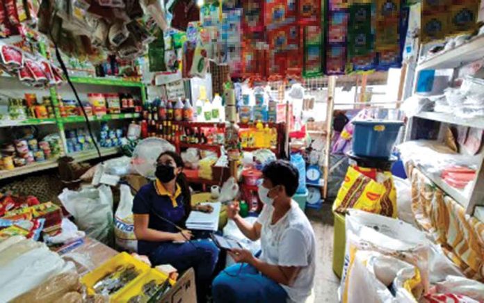 small-business-owners Personnel of the Iloilo provincial government inspects a mini grocery store in line with the implementation of the EMBRACE loan assistance program. The program is open to microentrepreneurs and returning overseas Filipino workers affected by the health pandemic. VELMA JANE LAO