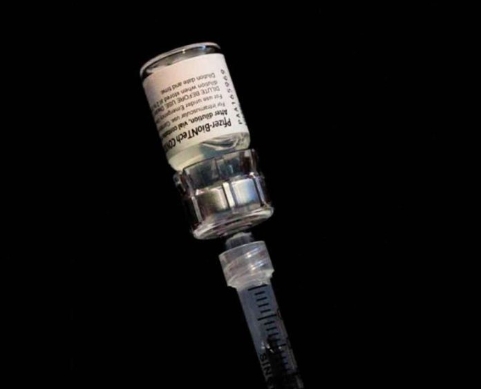 vaccine Pfizer says there could be rare reports of myocarditis after vaccinations, but such side effects were extremely rare. REUTERS/MARCO BELLO