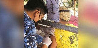 A person deprived of liberty receives a vaccine against coronavirus disease 2019 at the Iloilo City District Jail Male Dormitory in Barangay Ungka, Jaro, Iloilo City. All 338 inmates got of their first dose, according to Mayor Jerry Treñas. ILOILO CITY DISTRICT JAIL MALE DORMITORY