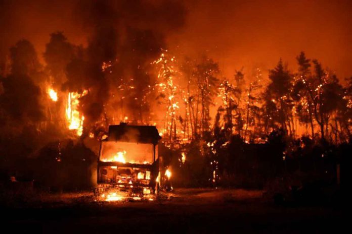 wildfire A wildfire burns in the village of Vasilika, on Evia Island, Greece, on August 7, 2021. Thousands of people have evacuated, and dozens of homes and businesses were destroyed due to the fire. REUTERS/ALEXANDROS AVRAMIDIS