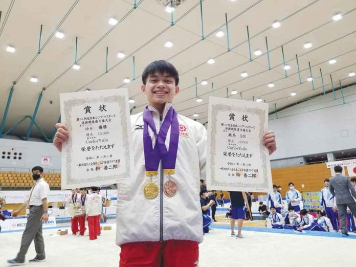 S-3-banner Carlos Edriel Yulo earns gold at the 2021 All-Japan Senior and Masters Gymnastics Championships by scoring 15.300 points in the floor exercise event. He also won a bronze medal in the vault competition. MUNEHIRO KUGIMIYA