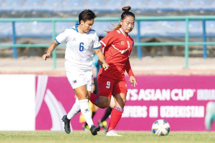 afc Philippine Malditas’ Tahnai Annis (6) battles with Nepal’s Sabita Rana Magar (9) for the loose ball during the 2022 AFC Women’s Asian Cup qualifiers in Uzbekistan. AFC