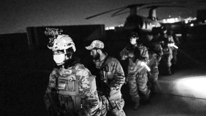afghanistan-w-3 Taliban fighters were quick to make use of discarded US military equipment as they entered Kabul airport early on Tuesday. GETTY IMAGES