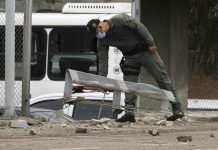 Explosion at Colombian police station injures 13 A police officer inspects damage at a police station after a bomb exploded in Cucuta, Colombia, on Monday. AP/FERLEY OSPINA