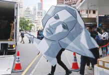 Hong Kong police raid Tiananmen Square museum The Hong Kong police remove a paper model of the Goddess of Democracy from the Tiananmen Square museum. REUTERS