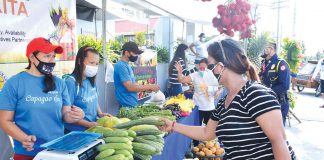 A customer scans the vegetables on display at the KADIWA ni Ani at Kita market outlet in Roxas City, Capiz. As inflation accelerates to 4.9 percent in the country, prices of basic goods increased swiftly in August, with food and household commodity expenses leading the way. According to the Philippine Statistics Authority, meat prices climbed by 16.4%, fish prices increased by 12.4%, and vegetable prices hiked by 15.7%. DA-6