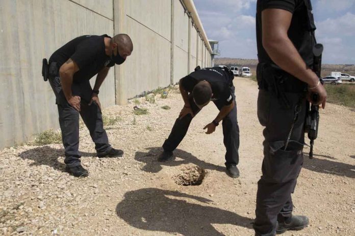 Police officers and prison guards inspect the scene of a prison escape outside the Gilboa prison in Israel. Israeli forces on Monday launched a massive manhunt in northern Israel and the occupied West Bank after several Palestinian prisoners have escaped. AP/SEBASTIAN SCHEINER