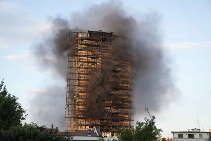 italy-w-2 Smoke billows from a building in Milan, Italy, on Sunday. Firefighters were battling a blaze that spread rapidly through a recently restructured 60-meter-high, 16-storey residential building. There were no immediate reports of injuries or deaths. AP/LUCA BRUNO