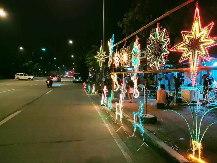 lanterns Christmas lanterns glow in the dark and make festive this portion of the sidewalk of the Diversion Road in Mandurriao, Iloilo City. Vendors of Christmas lanterns pray for better sales this year despite the coronavirus pandemic. PH PHOTO