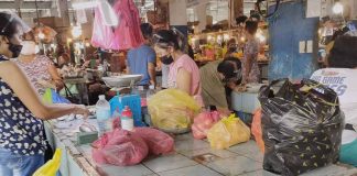 People wear facemask at the public market of Kalibo, Aklan. Masks help prevent the spread of coronavirus disease.