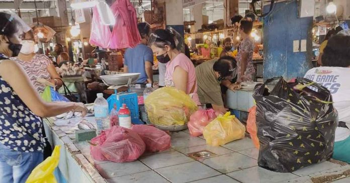 market-kalibo-aklan People wear facemask at the public market of Kalibo, Aklan. Masks help prevent the spread of coronavirus disease.
