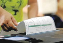 Iloilo City voters’ list tops 312,000 following purge A voter places her ballot in a PCOS machine after voting at precinct 169 of San Antonio High School in Makati City. According to Comelec, registered voters who are positive for COVID-19 can vote in the coming 2022 elections. INQUIRER/ARNOLD ALMACEN