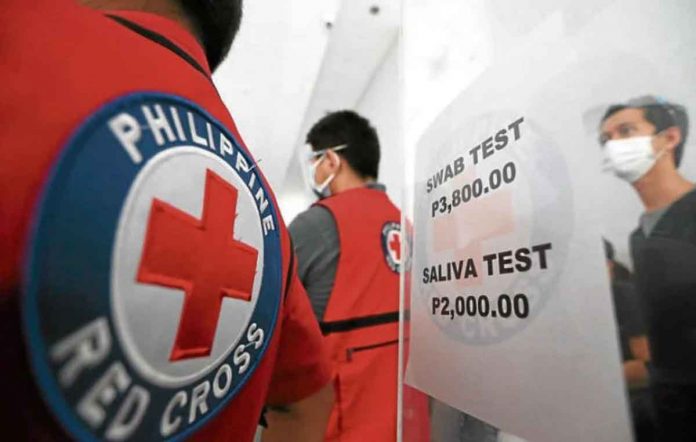 news-red-cross People taking COVID-19 tests at the Philippine Red Cross may now submit their saliva as specimen as the agency launches in January a cheaper alternative to the reverse transcription polymerase chain reaction testing through swabbing. INQUIRER/NIÑO JESUS ORBETA