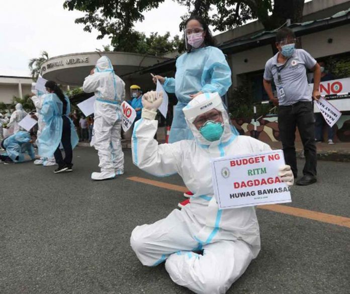 news-sra Research Institute for Tropical Medicine health workers stage a protest rally at their hospital grounds to demand the non-release of their Special Risk Allowance and other COVID-19 benefits. MARIANNE BERMUDEZ