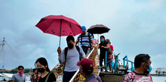 Passengers from the island province of Guimaras disembark from a motorboat at the Iloilo-Guimaras Ferry Terminal in Iloilo City. The provincial government of Guimaras is requiring all its job hires and applicants for job hire positions to get vaccinated against coronavirus disease 2019. PANAY NEWS PHOTO