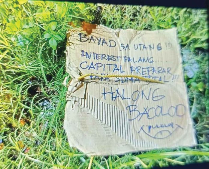 placard Drug suspect Glenn Pau Castillo was shot and beheaded late Tuesday night on Rosario Street, Barangay 38, Bacolod City. Police recovered a placard with a cryptic message next to the headless body. RADYO BANDERA BACOLOD