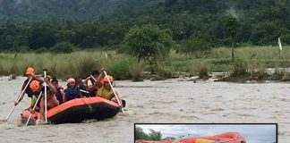Rescuers use an inflatable rubber boat to secure two women when the water level of the Cangaranan River in Barangay Canipayan, Valderrama, Antique suddenly rose on Sept. 8, 2021. PHOTOS BY ANTIQUE PDRRMO AND VALDERRAMA MDRRMO