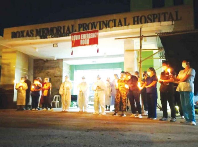 region-glenda-care In front of the Roxas Memorial Provincial Hospital in Roxas City, protesting healthcare workers urge local officials to prioritize health over politics. PHOTO FROM RMPH FACEBOOK PAGE