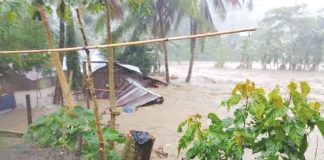 Rising floodwaters have swallowed much of this hut in Barangay Calacja 2, Hamtic, Antique. PHOTO JOEY DRANTO