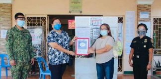 Mayor Evohn Nee Baldestamon of Patnongon, Antique receives the town’s Safety Seal certificate from the Department of Interior and Local Government .