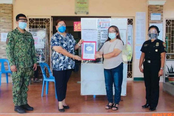 region-ime-patnongon Mayor Evohn Nee Baldestamon of Patnongon, Antique receives the town’s Safety Seal certificate from the Department of Interior and Local Government .