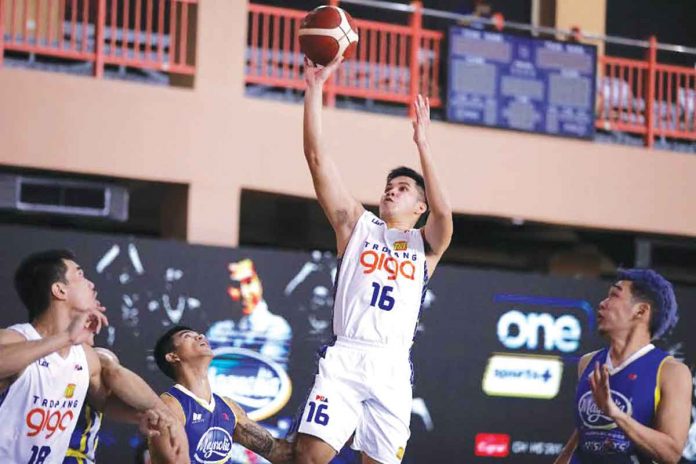 tnt-vs-magnolia Roger Pogoy of TNT Tropang GIGA goes for a one-handed basket during Sunday night's 2021 PBA Philippine Cup game against Magnolia Pambansang Manok Hotshots. PBA