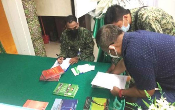 ASU The Aklan Police Provincial Office checks the books deemed “subversive” that were turned over to it by the Aklan State University. BANGA POLICE STATION PHOTO