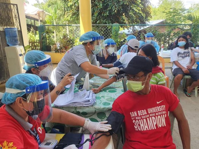 Leon, Iloilo Vaccination Healthcare workers check the blood pressure of residents of Barangay Gumboc, Leon, Iloilo prior to inoculation of AstraZeneca vaccine against coronavirus disease 2019 in the ongoing “Bakuna sa Barangay” of the Iloilo provincial government. PROVINCIAL HEATH OFFICE