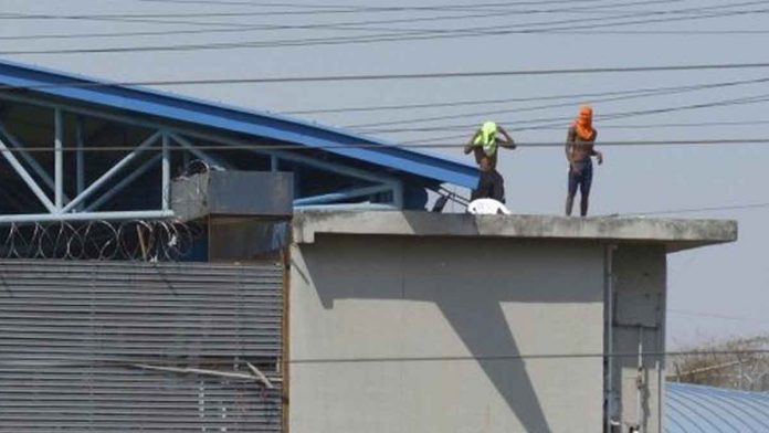 W-1 Inmates climb to the roof of the Litoral prison as a deadly fight unfolded in a jail in the city of Guayaquil, Ecuador. EPA